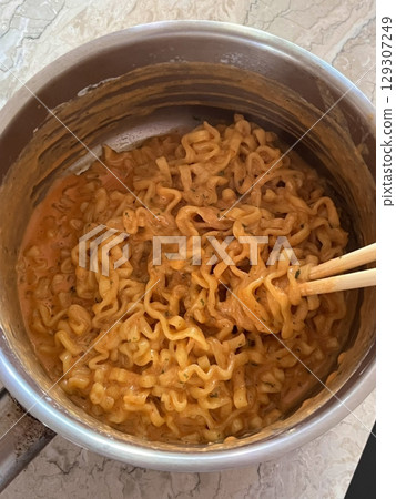 Shin Ramyun,close up of Ramyeon or Ramyun is a Korean-style soup noodle dish with a spicy flavor. Ramyeon or Korean instant noodles with egg - Korean food style 129307249