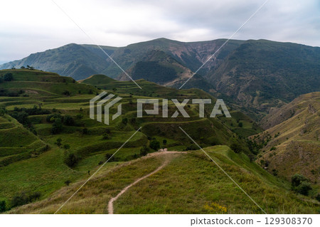 Chokhsky terraces Dagestan. Landscape of mountainous Dagestan with terraced fields and peaks mountains in the distance. Chokhsky terraces Dagestan. Landscape of mountainous Dagestan with terraced fields and peaks mountains in the distance. 129308370