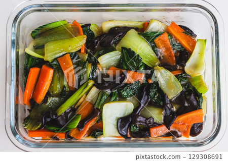 Chinese-style stir-fried vegetables with bok choy, wood ear mushrooms, and carrots 129308691