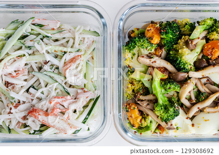 A pre-cooked home-cooked salad in a glass storage container 129308692