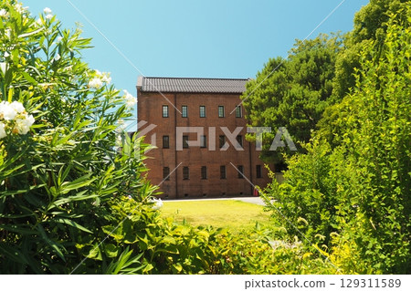 Red brick building against the blue sky 129311589