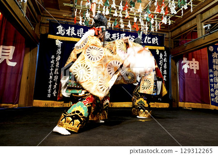 Iwami Kagura (Night Kagura) Performers dancing on the shrine's worship hall stage Iwami Kagura (Night Kagura) Performers dancing on the shrine's worship hall stage 129312265