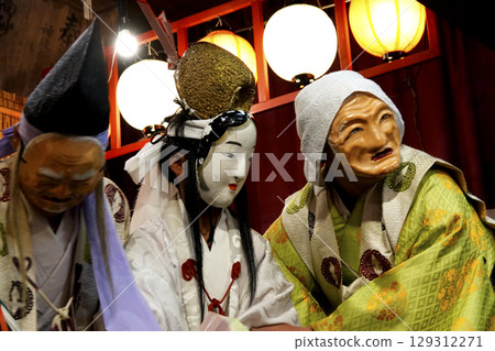 Iwami Kagura (Night Kagura) Performers dancing on the shrine's worship hall stage Iwami Kagura (Night Kagura) Performers dancing on the shrine's worship hall stage 129312271