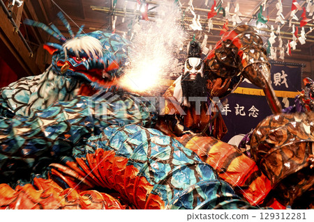 Iwami Kagura (Night Kagura) A performer plays the main character who slays a giant snake on the stage of the shrine's worship hall. Iwami Kagura (Night Kagura) A performer plays the main character who slays a giant snake on the stage of the shrine's worship hall. 129312281