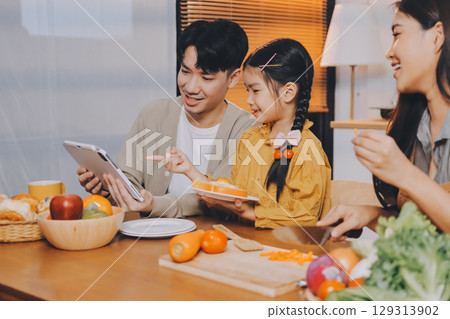 Family spends their free time together Family spends their free time together 129313902