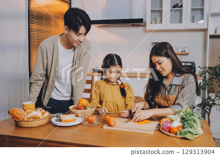 Family spends their free time together Family spends their free time together 129313904