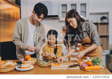 Family spends their free time together Family spends their free time together 129313910