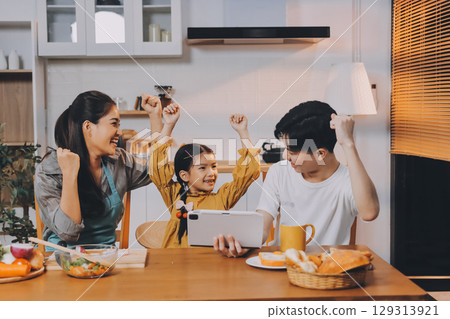 Family spends their free time together Family spends their free time together 129313921