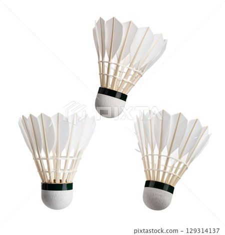 Isolated white badminton shuttlecock with racket on white background Isolated white badminton shuttlecock with racket on white background 129314137