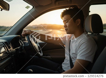 A male driver who seems tired and sleepy after driving A male driver who seems tired and sleepy after driving 129314276