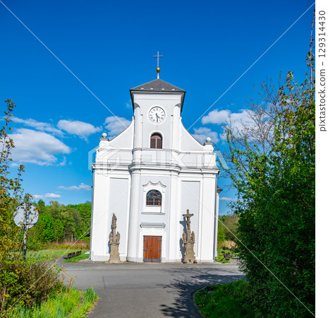 Frontal view of the leaning Church of St. Peter of Alcantara in Karvina, Czech Republic. The iconic tilted structure stands as a unique reminder of the area's mining history. Frontal view of the leaning Church of St. Peter of Alcantara in Karvina, Czech Republic. The iconic tilted structure stands as a unique reminder of the area's mining history. 129314430