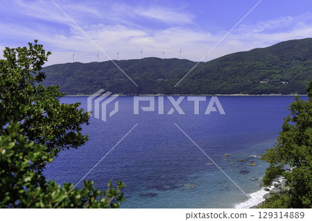 The blue sea of Ikata Town, Ehime Prefecture, and the windmills lined up on the Sada Misaki Peninsula The blue sea of Ikata Town, Ehime Prefecture, and the windmills lined up on the Sada Misaki Peninsula 129314889