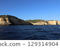 Sunlit Coastal Cliff in Algarve, Portugal 129314904