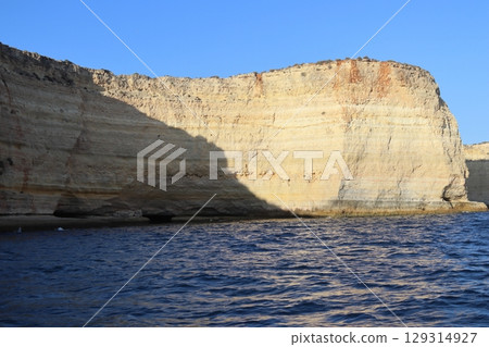 Sunlit Coastal Cliff in Algarve, Portugal Sunlit Coastal Cliff in Algarve, Portugal 129314927