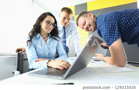 Team collaboration in a modern workspace with innovative ideas and technology during a productive meeting Team collaboration in a modern workspace with innovative ideas and technology during a productive meeting 129315010