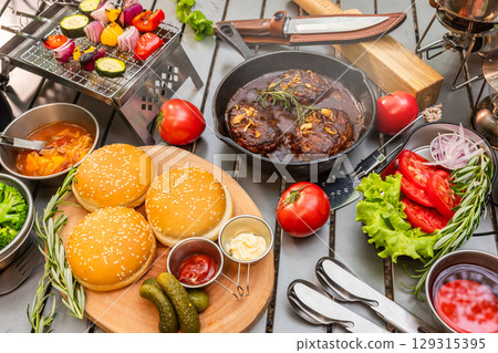Outdoor cooking at a campsite on holiday 129315395