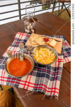 Outdoor cooking at a campsite on holiday Outdoor cooking at a campsite on holiday 129315402
