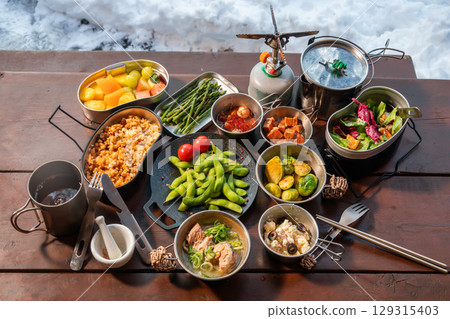 Outdoor cooking at a campsite on holiday Outdoor cooking at a campsite on holiday 129315403