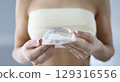 Exploring the elegance of silicone breast implants during a consultation in a bright and modern clinic 129316556