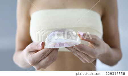 Exploring the elegance of silicone breast implants during a consultation in a bright and modern clinic Exploring the elegance of silicone breast implants during a consultation in a bright and modern clinic 129316556