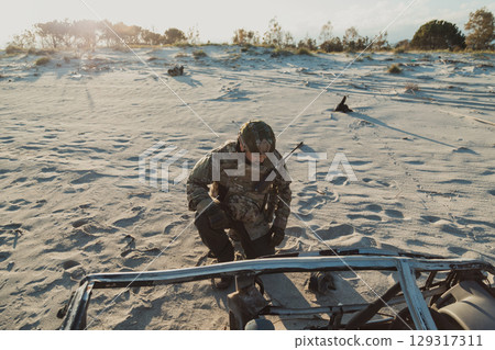 MIlitary Contractor On His Knees At The Beach  129317311