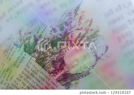 In-camera multiple exposure photo of dried flowers wrapped in newspaper In-camera multiple exposure photo of dried flowers wrapped in newspaper 129318187