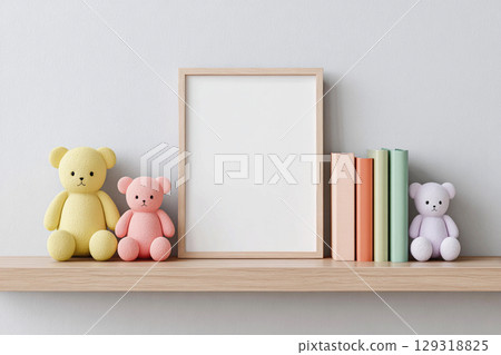 Blank frame for wall art mockup displayed on a wooden shelf alongside colorful plush toys and neatly arranged books in a cozy nursery setting Blank frame for wall art mockup displayed on a wooden shelf alongside colorful plush toys and neatly arranged books in a cozy nursery setting 129318825