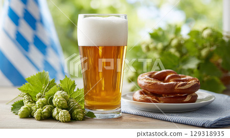Refreshing beer served with soft pretzel and fresh hops in a Bavarian setting during a Oktoberfest 129318935