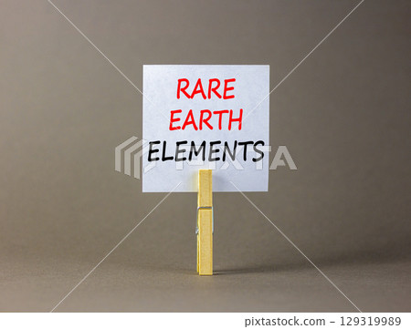 Rare earth elements symbol. Concept words Rare earth elements on beautiful white paper on wooden clothespin. Beautiful grey background. Business and rare earth elements concept. Copy space. Rare earth elements symbol. Concept words Rare earth elements on beautiful white paper on wooden clothespin. Beautiful grey background. Business and rare earth elements concept. Copy space. 129319989