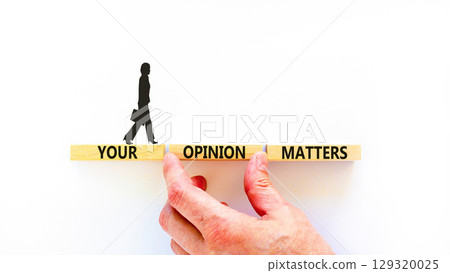Your opinion matters symbol. Concept words Your opinion matters on beautiful wooden blocks. Beautiful white background. Businesswoman icon. Business your opinion matters concept. Copy space. 129320025