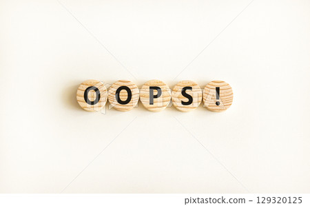 Oops symbol. Concept word Oops on beautiful wooden circles. Beautiful white table white background. Business lifestyle oops concept. Copy space. Oops symbol. Concept word Oops on beautiful wooden circles. Beautiful white table white background. Business lifestyle oops concept. Copy space. 129320125