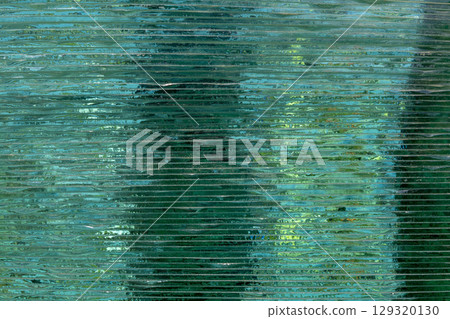 Glass Stacking Side View concept. Glass Factory produces a variety of transparent glass thicknesses. Beautiful typography background. Copy space. 129320130