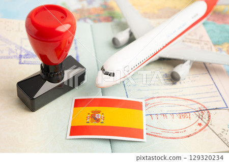 Spain passport with approved stamp on document for tourism to immigration at airport in country. 129320234