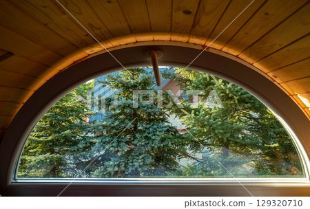 Window with a view of trees and houses Window with a view of trees and houses 129320710