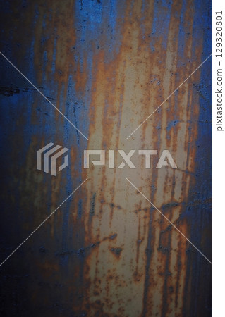 A rusty metal surface with a blue and brown color. Vertical composition ideal for phone wallpaper or minimal nature backgrounds. 129320801