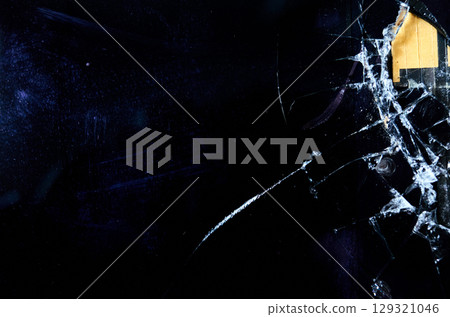 Black and white photo of a window with a broken pane Black and white photo of a window with a broken pane 129321046