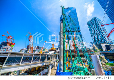 Tokyo cityscape, Japan, August 5th. Extremely hot... Huge heavy machinery such as piledrivers lined up... Towards a new chapter... = Shibuya Tokyo cityscape, Japan, August 5th. Extremely hot... Huge heavy machinery such as piledrivers lined up... Towards a new chapter... = Shibuya 129321317