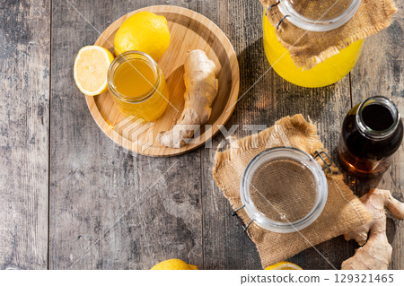 Colorful Kombucha Jars and Bottles on wooden table Colorful Kombucha Jars and Bottles on wooden table 129321465