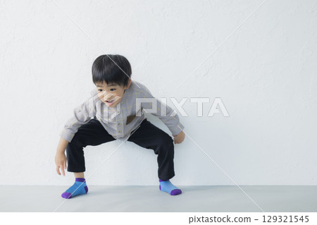 Smiling boy playing Smiling boy playing 129321545