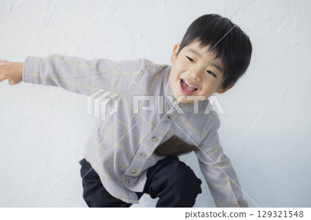 Smiling boy playing Smiling boy playing 129321548