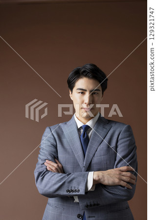 Smiling young man in a suit Smiling young man in a suit 129321747