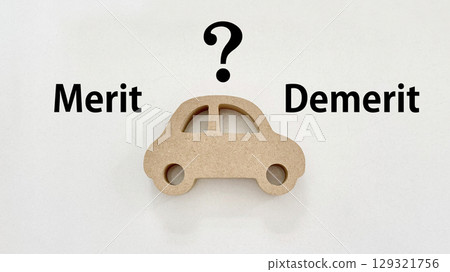 Natural car accessories with Merit and Demerit letters and a question mark 129321756