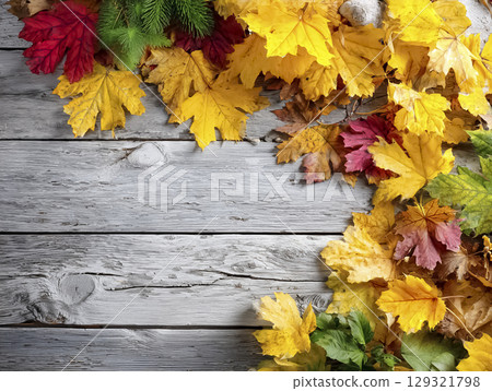 Image material of fallen leaves placed on a wooden board 129321798