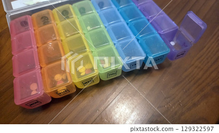 Weekly pill box organizer for managing daily medication and supplements 129322597