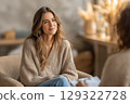 Woman having a therapeutic session, discussing emotional well being, counseling session, female 129322728