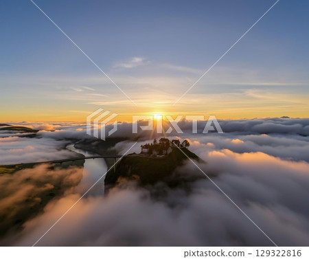 Golden Hour Serenity: A Misty Mountain Village Embrace 129322816