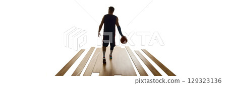 Silhouette of basketball player walking away on unfinished wooden court holding ball. Banner Silhouette of basketball player walking away on unfinished wooden court holding ball. Banner 129323136