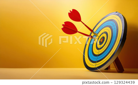 Achieving business goals with arrow darts hitting target, symbolizing success 129324439