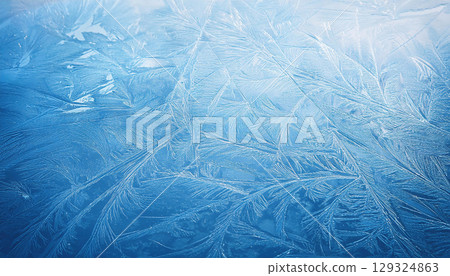 Textured ice surface with natural scratches showcasing cool winter palette 129324863