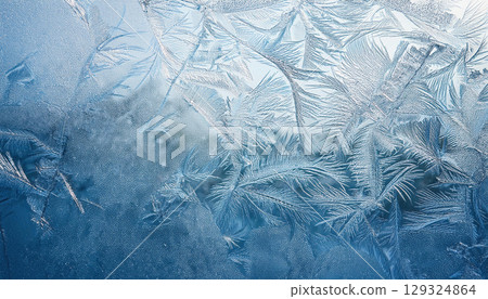 Textured ice surface with natural scratches showcasing cool winter palette 129324864